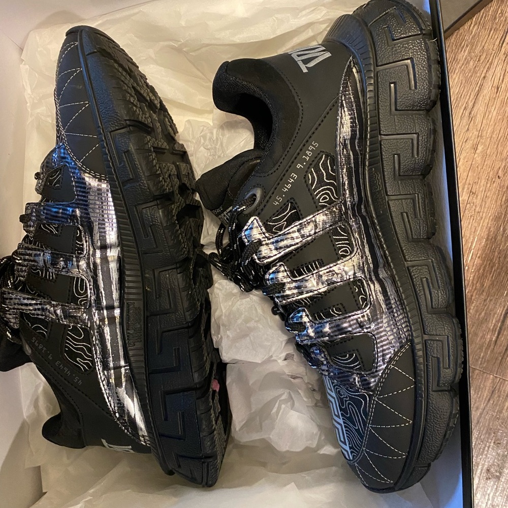 Size 43 Versace sneakers only worn once . Paid 850 comes with original box